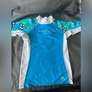 Tuga Girl Turks & Caicos Island girl blue swim shirt 6/7 yrs